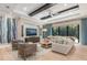 Bright and airy living room with hardwood floors, modern decor, and sliding glass doors to the outdoor area at 412 Pheasant Way, Sarasota, FL 34236