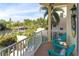 Charming balcony overlooking lush greenery and a canal, furnished with comfortable seating at 449 Canal Rd # 449, Sarasota, FL 34242