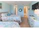 Bedroom featuring coastal decor and an ensuite bathroom with a walk-in shower at 449 Canal Rd # 449, Sarasota, FL 34242