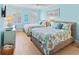 Guest bedroom featuring two beds, coastal decor, and a light fixture at 449 Canal Rd # 449, Sarasota, FL 34242
