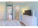 Bright bedroom with beach decor that leads to bathroom and living area at 449 Canal Rd # 449, Sarasota, FL 34242