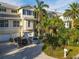 Inviting two-story home with lush landscaping, driveway, and two-car garage at 449 Canal Rd # 449, Sarasota, FL 34242