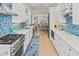 Gourmet kitchen featuring stainless steel appliances, a tile backsplash, and an island at 449 Canal Rd # 449, Sarasota, FL 34242