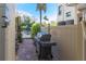 Outdoor patio area featuring a grill, lush plants, and a dining set at 449 Canal Rd # 449, Sarasota, FL 34242