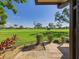 Backyard patio and landscaped lawn area overlooking the golf course at 4534 La Jolla Dr, Bradenton, FL 34210