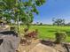 Backyard with gravel, plants, shrubs, trees, patio and view of the green lawn at 4534 La Jolla Dr, Bradenton, FL 34210