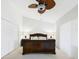 Bedroom with dark wood furniture, ceiling fan, closet, and neutral decor at 4534 La Jolla Dr, Bradenton, FL 34210
