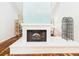 Bright living room with a brick fireplace at 4534 La Jolla Dr, Bradenton, FL 34210