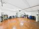 Spacious garage features a washer and dryer, utility sink, ample storage, and an epoxy floor at 4534 La Jolla Dr, Bradenton, FL 34210