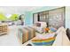 Bright sitting area offers comfortable furniture, tiled floors, and plenty of space at 4534 La Jolla Dr, Bradenton, FL 34210