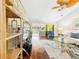 Sunlit living room boasts hardwood floors, sliding glass doors to the lanai, and comfortable seating at 4534 La Jolla Dr, Bradenton, FL 34210