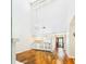 Living room with high ceilings, hardwood floors, and abundant natural light at 4534 La Jolla Dr, Bradenton, FL 34210