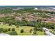 Aerial view of the community showcasing lush greenery, ponds, and well-maintained buildings at 4761 Travini Cir # B102, Sarasota, FL 34235