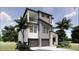 Two-story modern house featuring a two-car garage, balcony, and lush tropical foliage at 4903 Commonwealth Dr, Sarasota, FL 34242