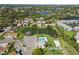Community aerial view with lake, swimming pool and mature landscaping at 5020 Live Oak Cir, Bradenton, FL 34207