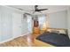 Bright bedroom with hardwood floors, natural light, and en-suite bathroom access at 5020 Live Oak Cir, Bradenton, FL 34207