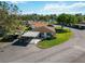 Charming home with carport, mature trees, and well-maintained landscaping at 5020 Live Oak Cir, Bradenton, FL 34207