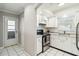 Classic white kitchen equipped with stainless steel appliances and ample counter space at 5020 Live Oak Cir, Bradenton, FL 34207
