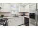 Classic kitchen featuring stainless steel appliances, and white cabinetry at 5020 Live Oak Cir, Bradenton, FL 34207