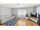 Bright living room featuring hardwood floors, neutral paint, a sofa, and natural light at 5020 Live Oak Cir, Bradenton, FL 34207