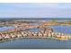 Waterfront homes in a community with interconnected waterways and lush landscaping at 525 Maraviya Blvd, Nokomis, FL 34275