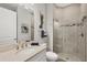 Modern bathroom featuring tiled shower, granite vanity, and turtle decor at 525 Maraviya Blvd, Nokomis, FL 34275