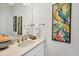 Tastefully decorated half bath with blue parrot art and coastal decor at 525 Maraviya Blvd, Nokomis, FL 34275