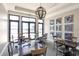 Card and game room with pendant lighting and picture windows at 525 Maraviya Blvd, Nokomis, FL 34275