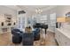 Bright dining room with a glass table, seating, piano and elegant décor at 525 Maraviya Blvd, Nokomis, FL 34275