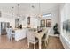 Bright and airy dining room with a modern chandelier and adjacent kitchen at 525 Maraviya Blvd, Nokomis, FL 34275
