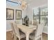 Elegant dining room with natural light, comfortable seating, and serene decor at 525 Maraviya Blvd, Nokomis, FL 34275