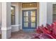 Close up showcasing double doors, a brick entryway and beautiful landscaping at 525 Maraviya Blvd, Nokomis, FL 34275