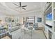 A stylish living room with comfortable furniture, beautiful tile floors, and a view of the water at 525 Maraviya Blvd, Nokomis, FL 34275