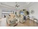 A stunning living room with gorgeous tile floors, neutral-colored furniture, and a lovely water view at 525 Maraviya Blvd, Nokomis, FL 34275