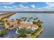 Community pool with lounge seating, clubhouse and parking at 525 Maraviya Blvd, Nokomis, FL 34275