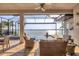 Screened-in pool and patio overlooking the open water and a serene vista at 525 Maraviya Blvd, Nokomis, FL 34275