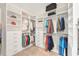 Spacious walk-in closet with custom shelves and drawers for organized storage of clothes and accessories at 525 Maraviya Blvd, Nokomis, FL 34275