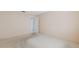 Neutral bedroom with a closet and plain walls, providing a blank canvas for customization at 5571 Riverbluff Cir # V1, Sarasota, FL 34231