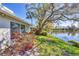 Beautiful backyard view features serene pond and lush landscaping, creating a peaceful oasis at 5608 Country Club Way # 5608, Sarasota, FL 34243