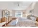 Comfortable bedroom with a relaxing view, ceiling fan, and wood flooring for a welcoming atmosphere at 5608 Country Club Way # 5608, Sarasota, FL 34243