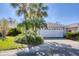 Charming single-story home with lush tropical landscaping and a two-car garage at 5608 Country Club Way # 5608, Sarasota, FL 34243