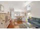 Open-concept living room and dining area with vaulted ceilings and a large window at 5608 Country Club Way # 5608, Sarasota, FL 34243