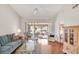 Bright living room boasts hardwood floors, high ceilings, and scenic views at 5608 Country Club Way # 5608, Sarasota, FL 34243