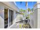 Outdoor patio with a table set, decorated with a white lattice fence, providing an intimate outdoor area at 5608 Country Club Way # 5608, Sarasota, FL 34243