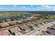 An aerial view of a beautiful community showcasing lake views and lush landscaping at 6070 Mesa Gln, Bradenton, FL 34203
