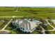 Stunning aerial view of the home with a large pool, manicured lawns, and scenic landscaping at 6070 Mesa Gln, Bradenton, FL 34203