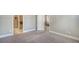 Neutral bedroom featuring carpeted floors, and a view into an en suite bathroom at 6070 Mesa Gln, Bradenton, FL 34203
