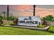 Esplanade at the Heights community sign with palm trees against a colorful sunrise sky at 6070 Mesa Gln, Bradenton, FL 34203
