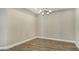 Cozy dining room features modern lighting and wood-look flooring at 6070 Mesa Gln, Bradenton, FL 34203