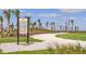 Outdoor exercise station along a walking path with instructional signage and fitness equipment for residents' well-being at 6070 Mesa Gln, Bradenton, FL 34203